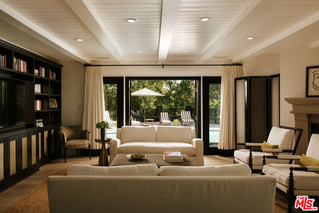Living room with built-in bookshelves, 16822 Escalon Dr