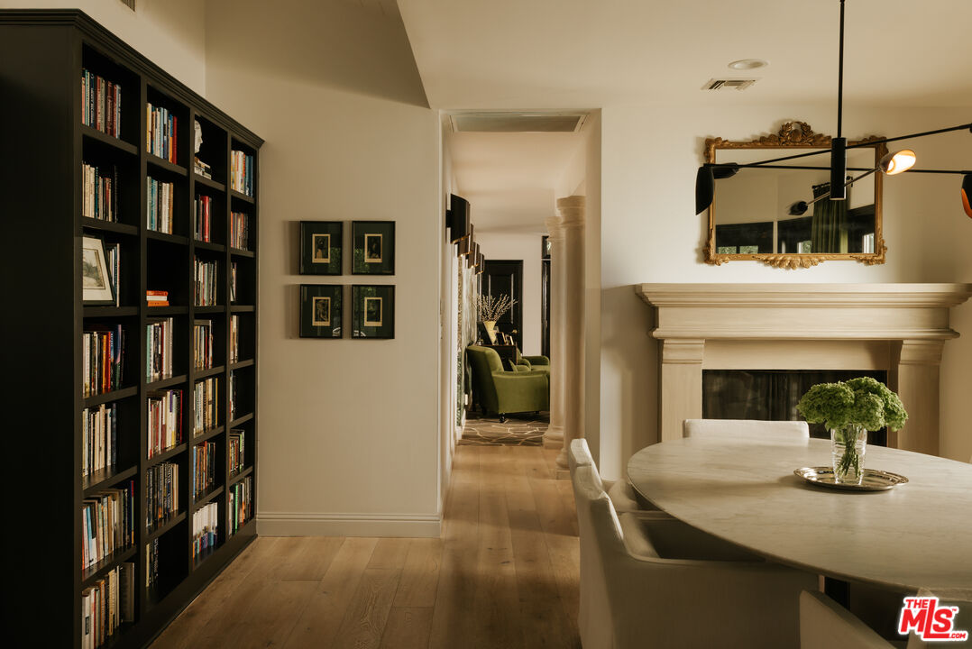 Dining area with fireplace and bookshelves, 16822 Escalon Dr