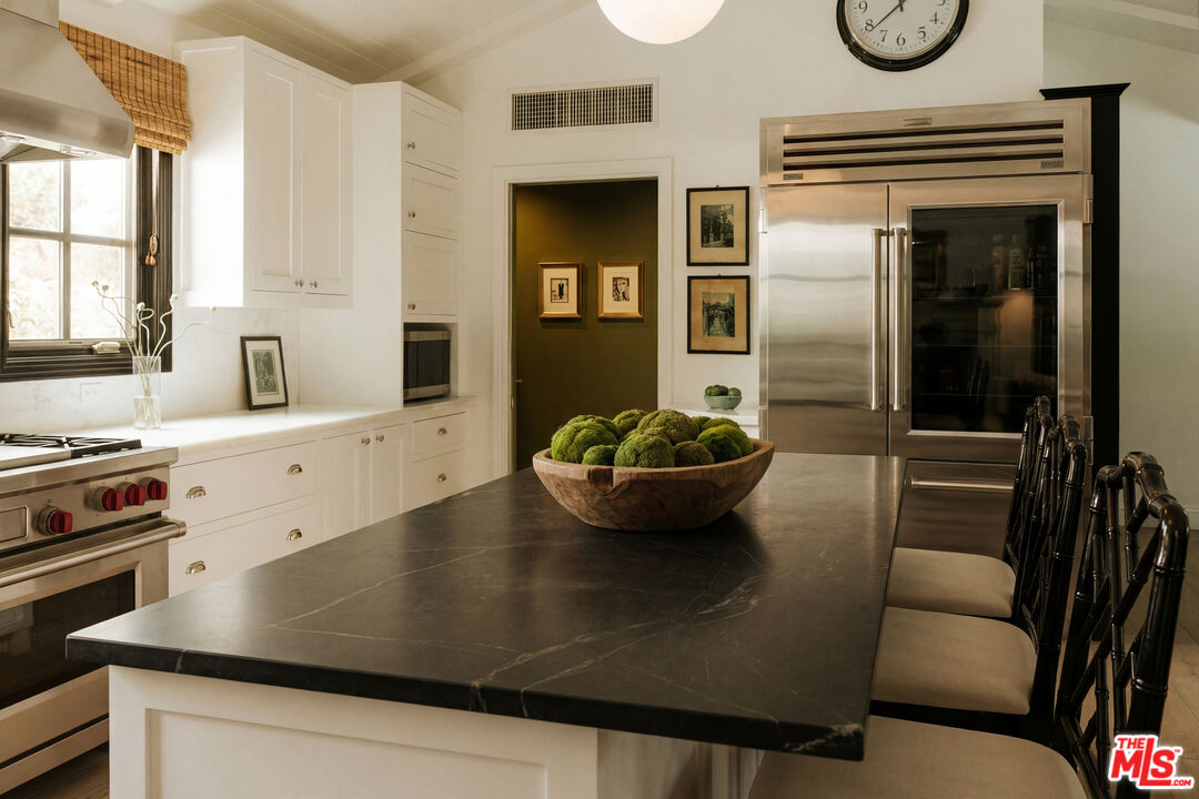 Kitchen island and Sub-Zero refrigerator, 16822 Escalon Dr