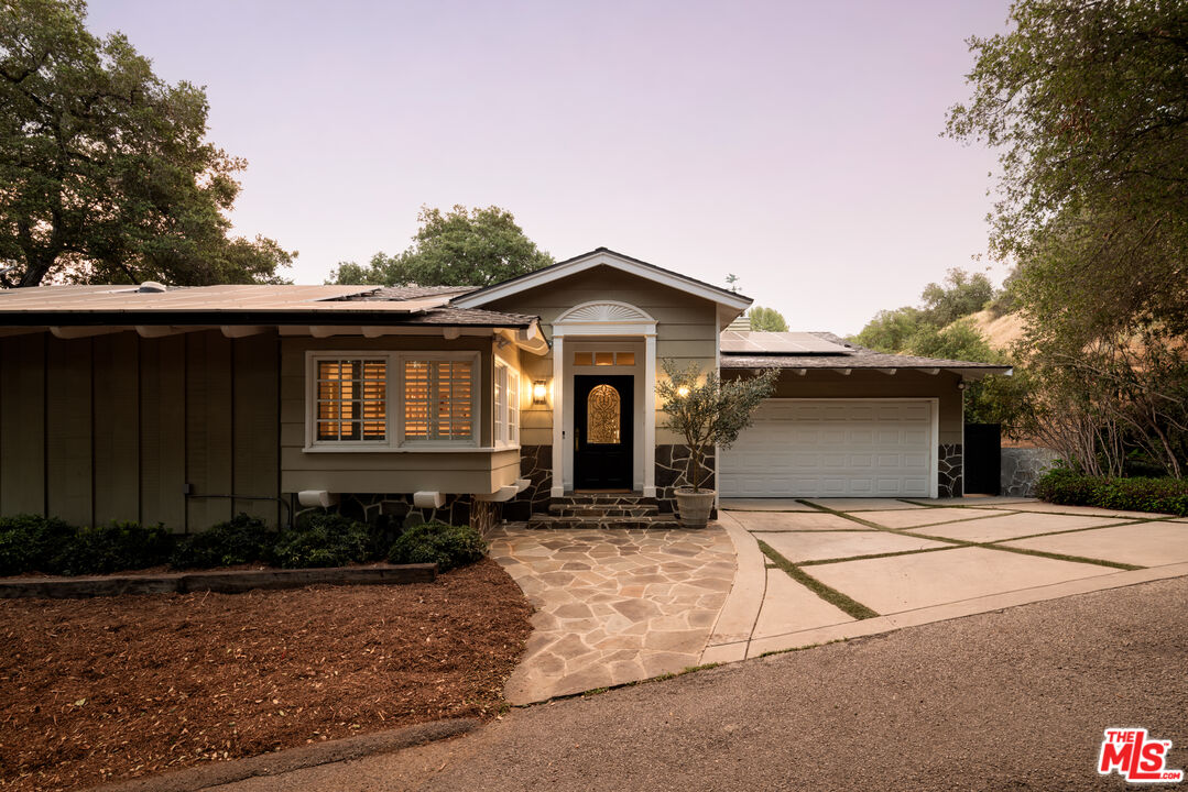 Front of the home at dusk, 16822 Escalon Dr