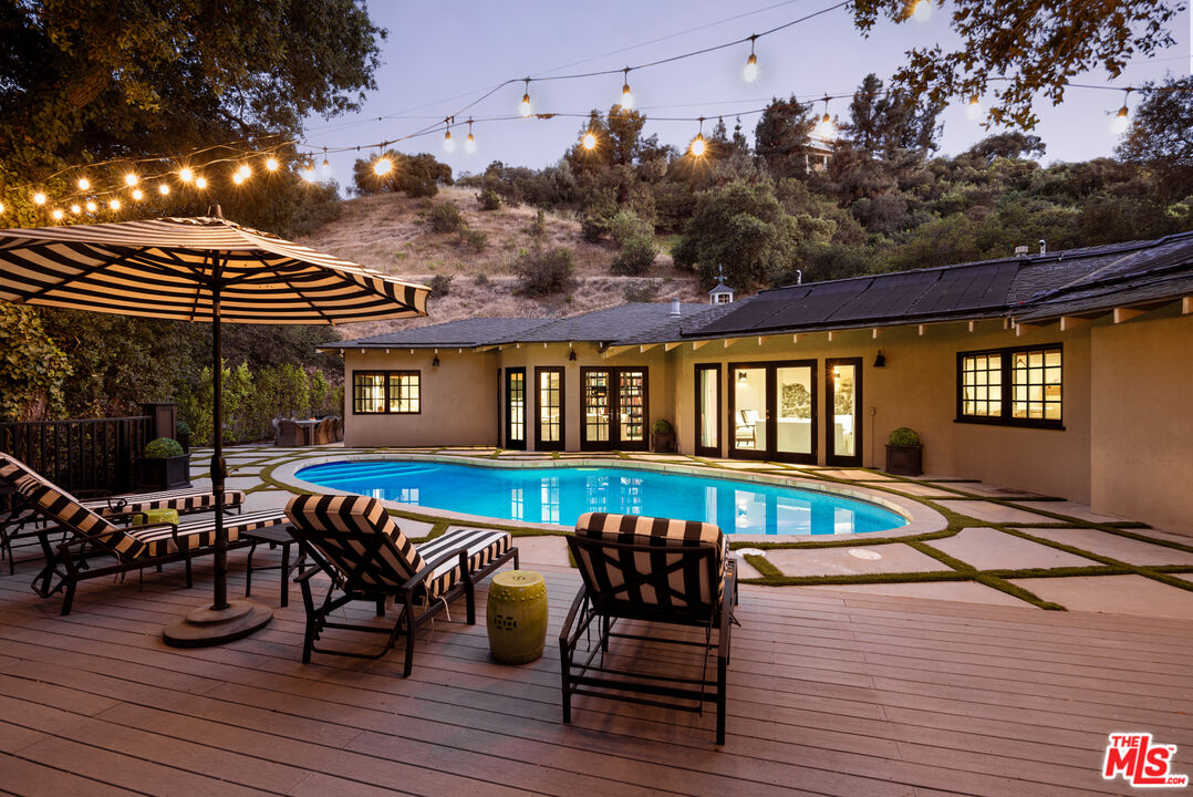 Pool and patio at dusk, 16822 Escalon Dr