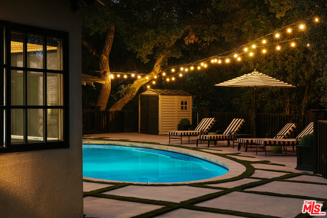 Pool terrace at night, 16822 Escalon Dr