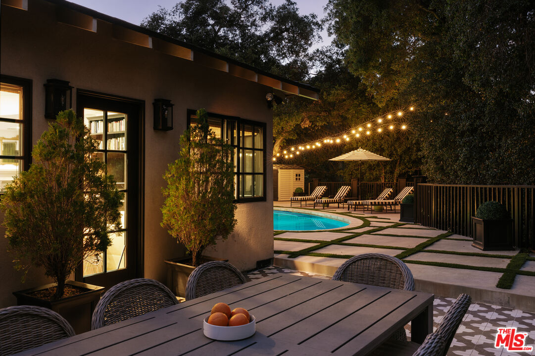 Patio dining at night, 16822 Escalon Dr